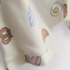 0–18 miesięcy | komplet składający się z bluzy i szortów z nadrukiem motywu jedzenia