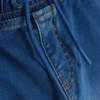 7–15 lat | jeansy typu sweatpants z podwiniętymi nogawkami