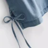 Bawełniany top z denimu z wiązaniem po bokach