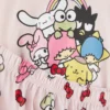 Bluzka piżamowa z nadrukiem Hello Kitty i przyjaciół
