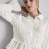 Bluzka z marszczonym dołem w stylu peplum