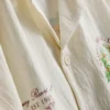 Koszula z kołnierzykiem typu „reverse” i nadrukiem krajobrazowym