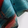 Koszula z krótkim rękawem zapinana na guziki z nadrukiem flamingów