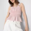 Top bez rękawów z marszczonym dołem w stylu peplum