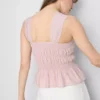 Top bez rękawów z marszczonym dołem w stylu peplum