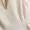 Top bez rękawów z peplum i dekoltem w serek