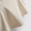 Top bez rękawów z peplum i dekoltem w serek