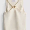 Top z dekoltem typu halter z motywem rozgwiazdy